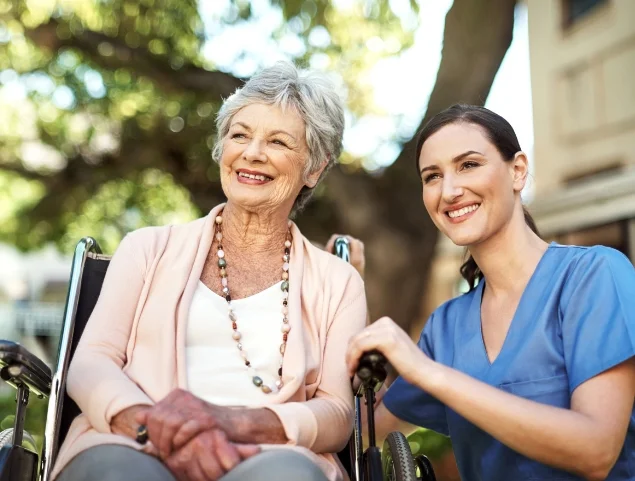 woman in wheelchair with nurse