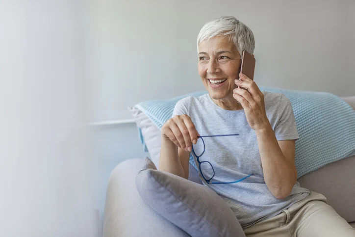 a senior woman talking on the phone