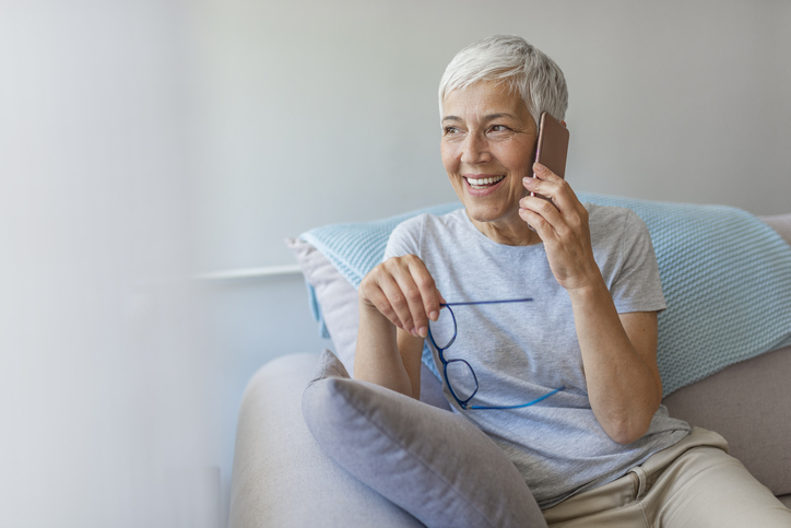 a senior woman talking on the phone