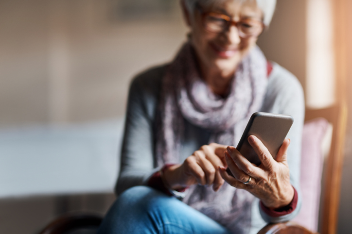 an elderly woman using a smartphone