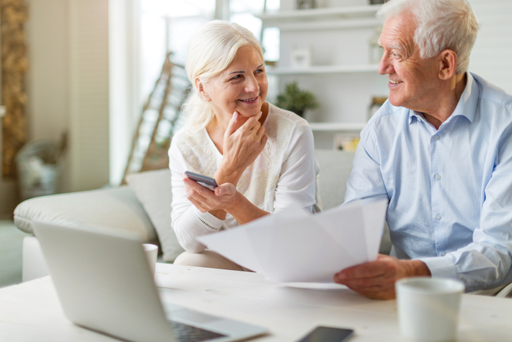 Senior couple looking through paperwork