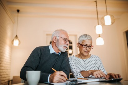 senior couple working on their senior living finances